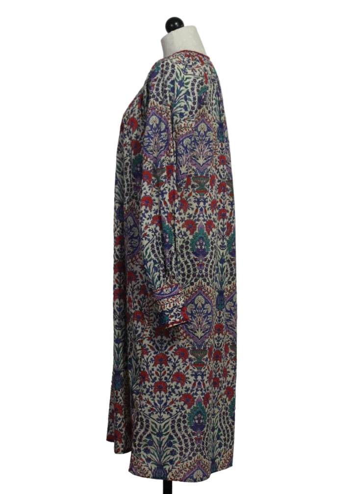 side view of The long sleeve cotton floral Riffy Dress by MKT Studio
