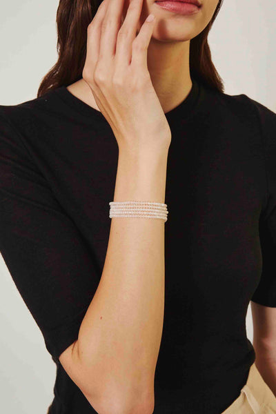 model wearing Mystic Clear Quartz 5 Wrap Crystal Bracelet by Chan Luu