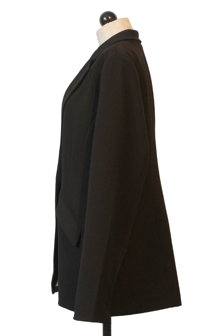 side view of The Favorite Blazer by Favorite Daughter in Black with a single button closure 