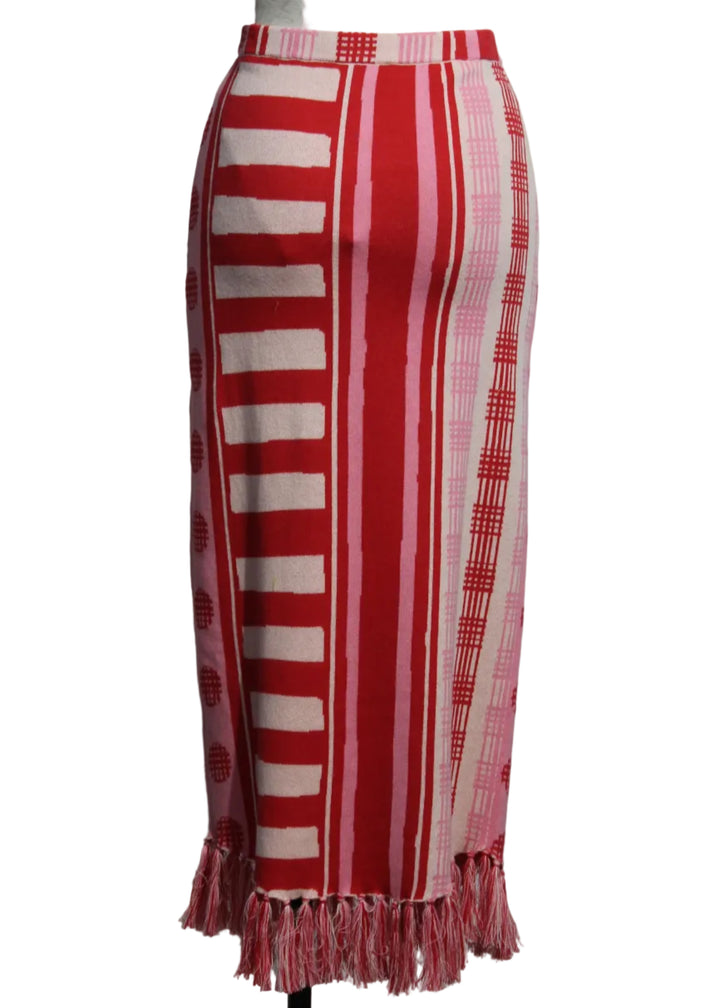 back view of Peach Jubilee colored Cotton Capri Knit Skirt by Emily McCarthy with fringed bottom