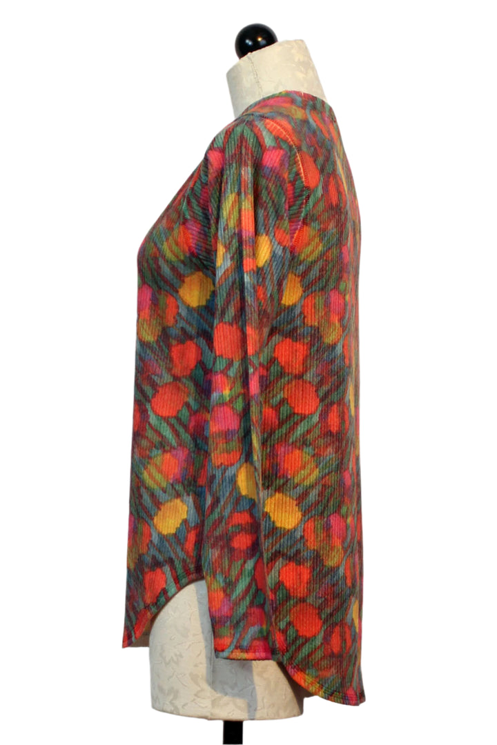 side view of Multicolor Long Sleeve Ribbed Camo Floral V-Neck Top by Nally and Millie