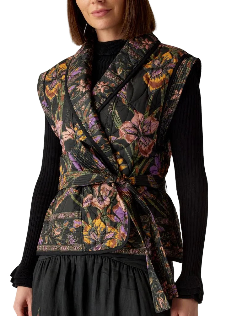 model wearing the BOWIE VEST by Marie Oliver in the Nightshade print paired with the Black Tinley Turtleneck by Marie Oliver