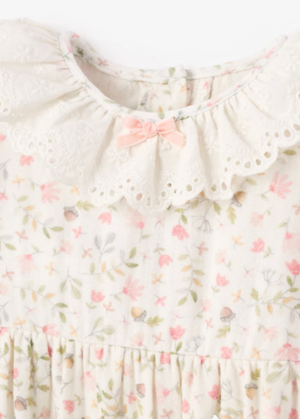 close up view of Fairytale Floral Organic Muslin Jumpsuit with Eyelet by Elegant Baby