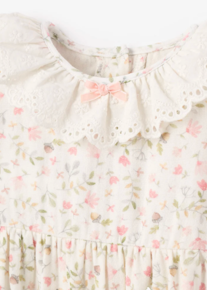 close up view of Fairytale Floral Organic Muslin Jumpsuit with Eyelet by Elegant Baby