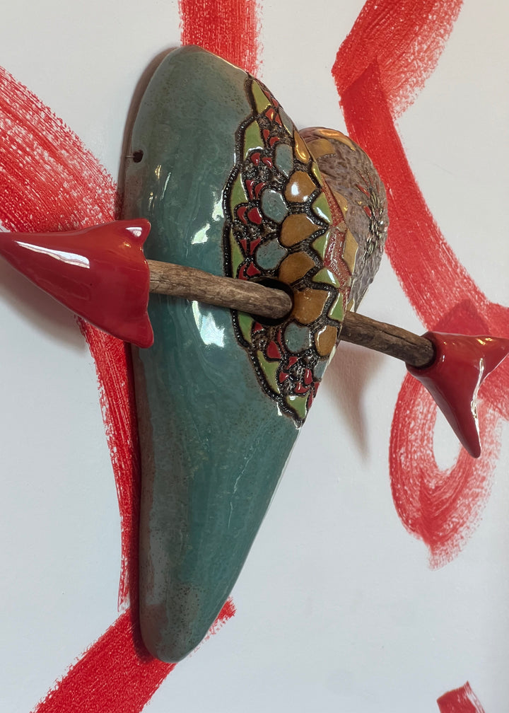 side view of The Adventures of Ali by Laurie Pollpeter Eskenazi Ceramic Heart Wall Sculpture