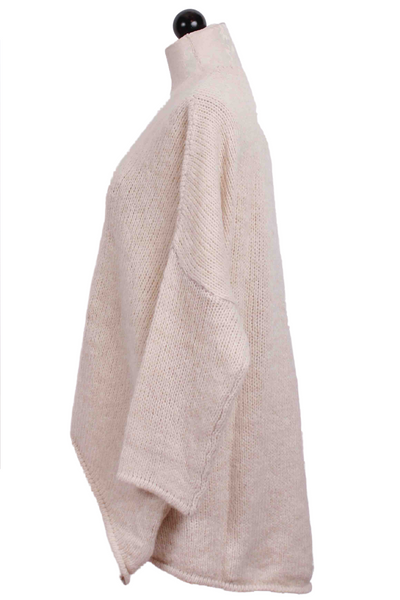 side view of Cream Drop Shoulder High Low Sweater by Alembika