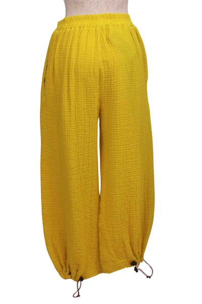 back view of Lime Andi Gauzy Cotton Pant by Kozan that gathers down at the ankle with a pull-tie