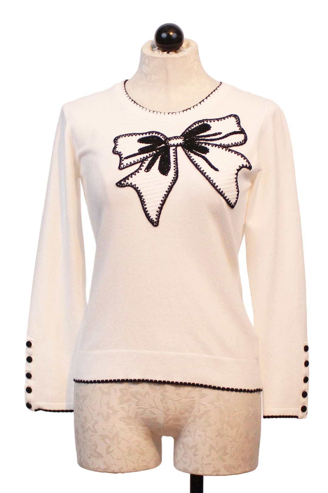 Off White Sweater with Black outlined Embroidered Bow and whipstitched edges by Leo &amp; Ugo