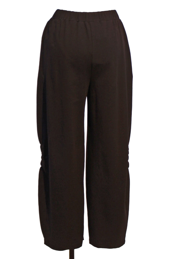 back view of Almila Pant by Kozan with ruched rosette-like detail along the bottom