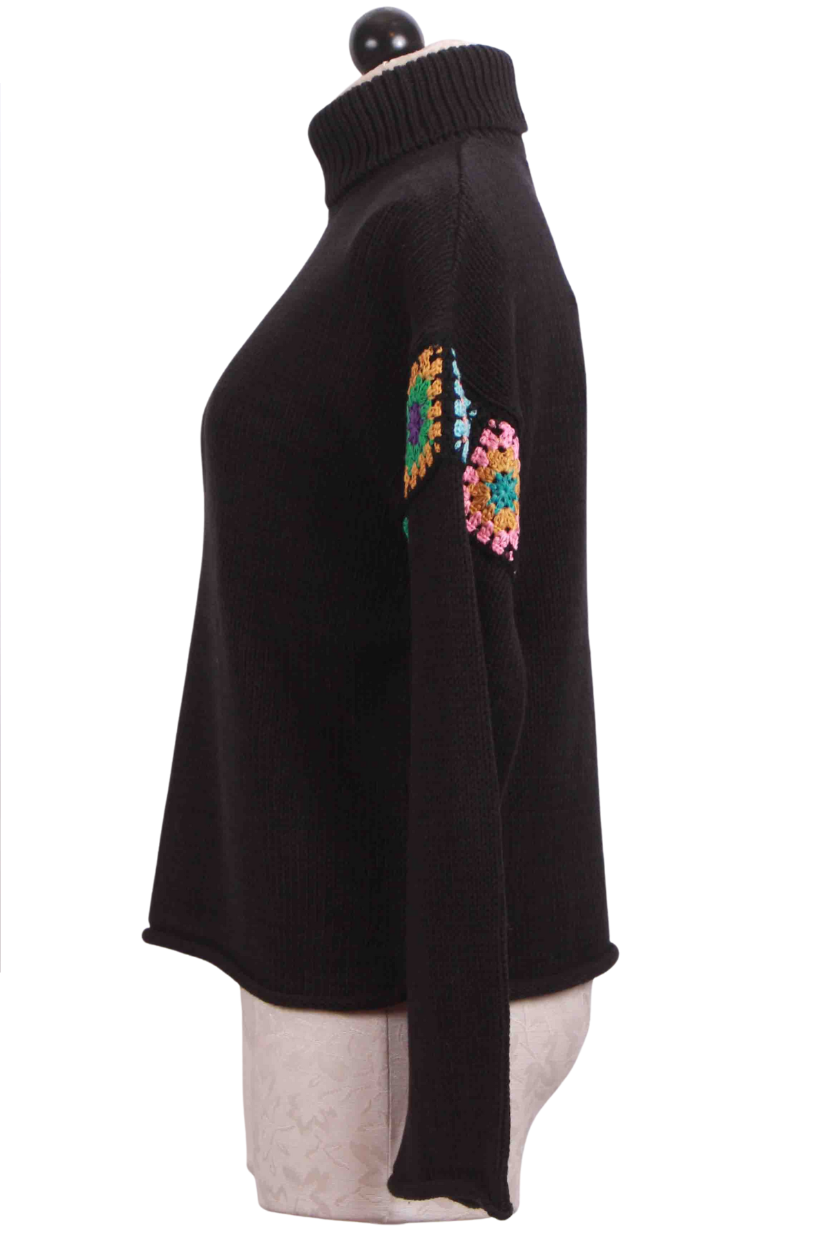 Side view of Black In The Loop Sweater by Lisa Todd with Drop Crocheted Trimmed Shoulder Sleeve