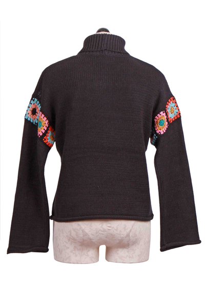 back view of Black In The Loop Sweater by Lisa Todd with Drop Crocheted Trimmed Shoulder Sleeve