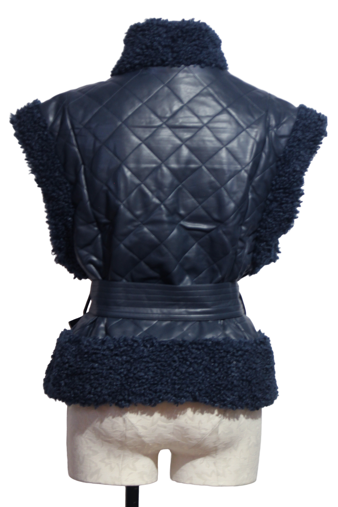 back view of Naval colored Beatrice Vest by Marie Oliver is a quilted vegan leather 