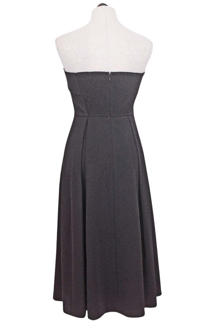 back view of Black Belle Dress by Rue Sophie is a strapless dress with a fold over neckline