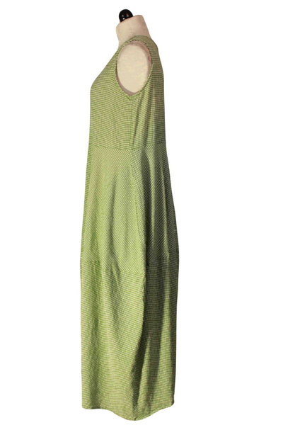 side view of Seamed Bubble Dress by Cut Loose in a Fava Green Crinkle Check