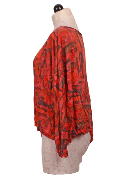 side view of Coral Abstract Cropped Curved Hem Top by Reina Lee
