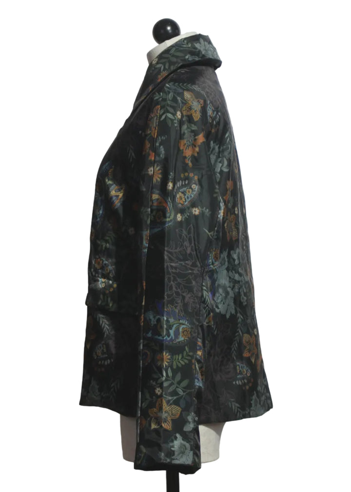side view of The Lightweight, Packable, Reversible Puffer by Johnny Was in the Solana Scarf Print and Solid Black on the reverse side