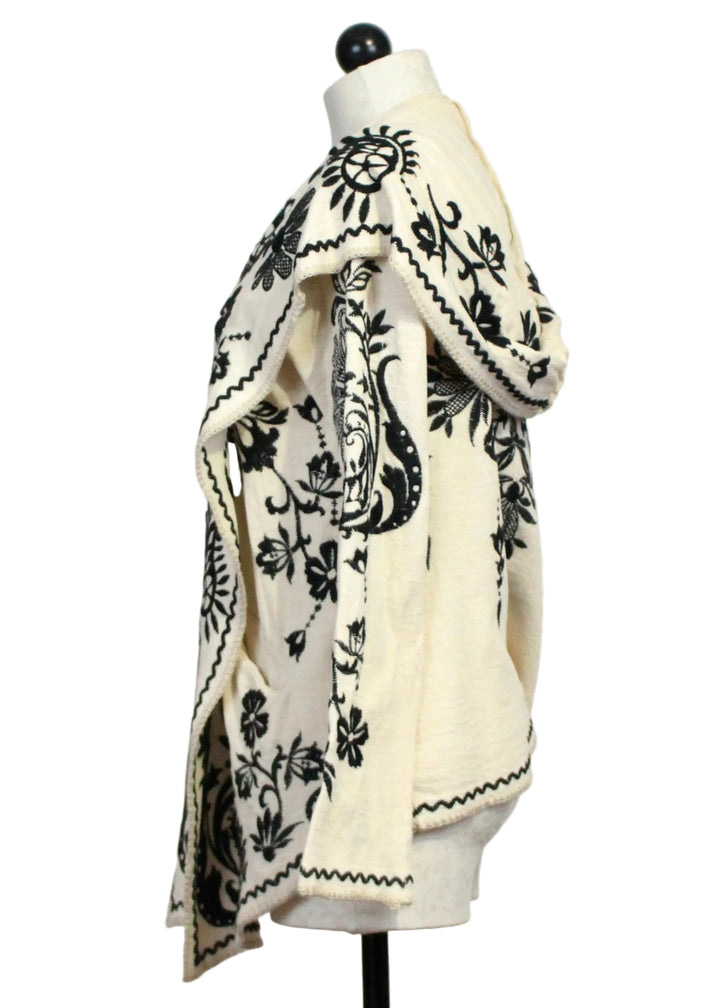 Side view of ECRU colored Biya Short Hoodie by Johnny Was with Black Embroidery
