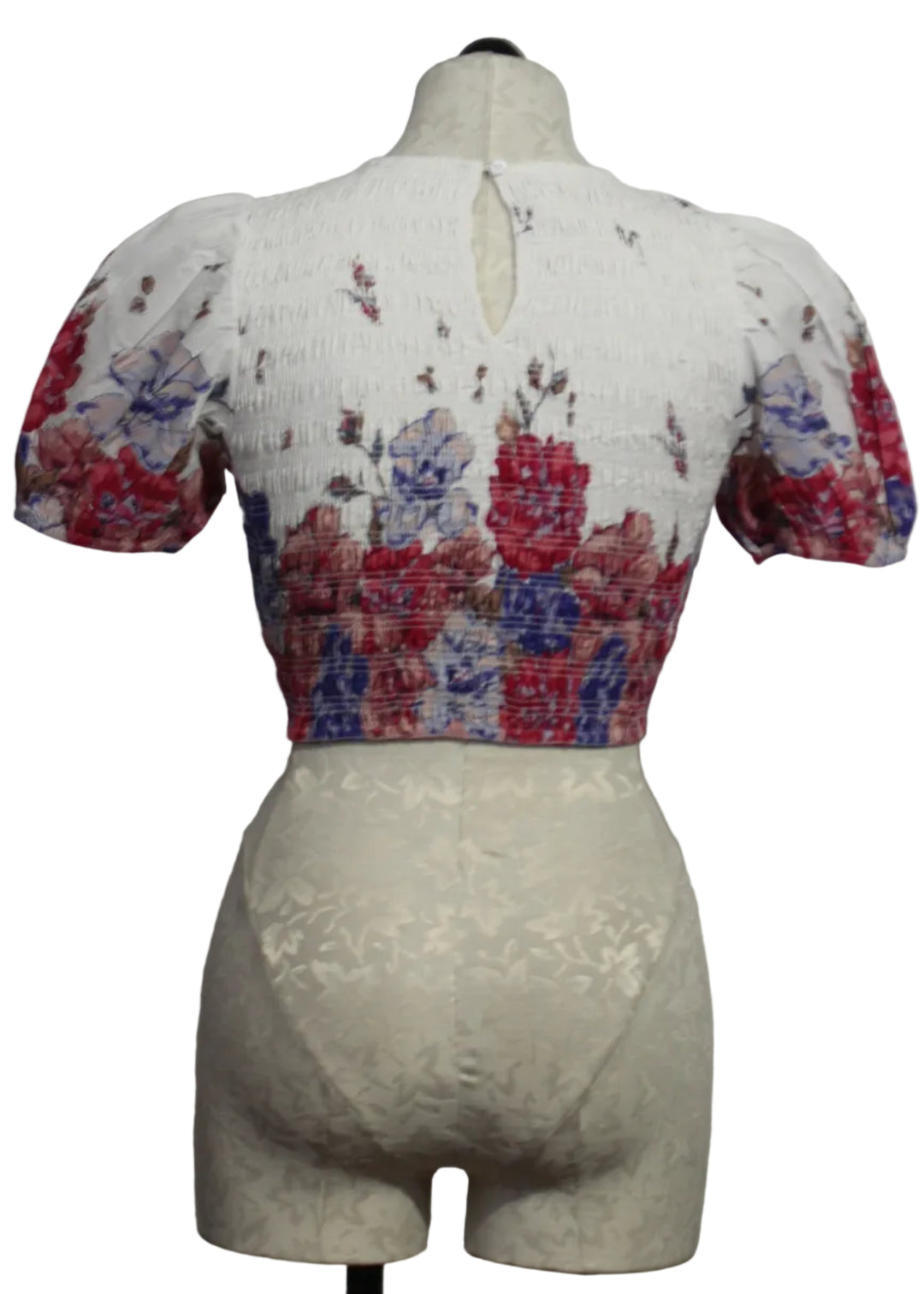 back view of Floral Rya Smocked Top by Cleobella with Blouson Sleeves in the Camellia Print