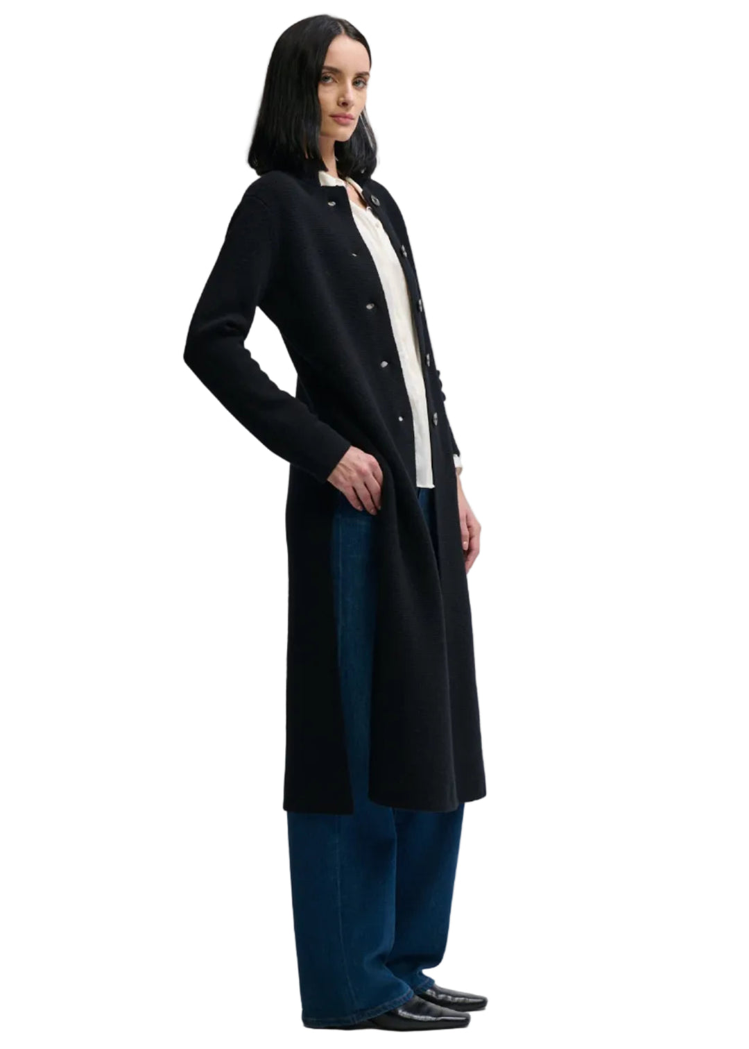 side view of back view of model wearing the BLACK colored Imperial Sweater Coat by Margaret Oleary