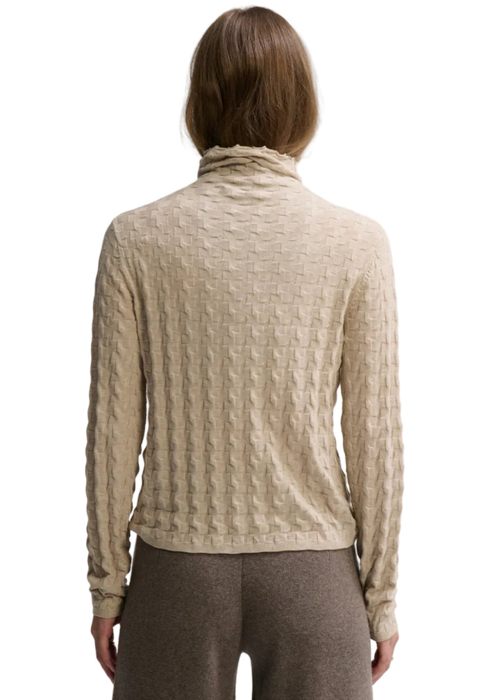 back view of model wearing the Almond color 3D Neck by Margaret O&