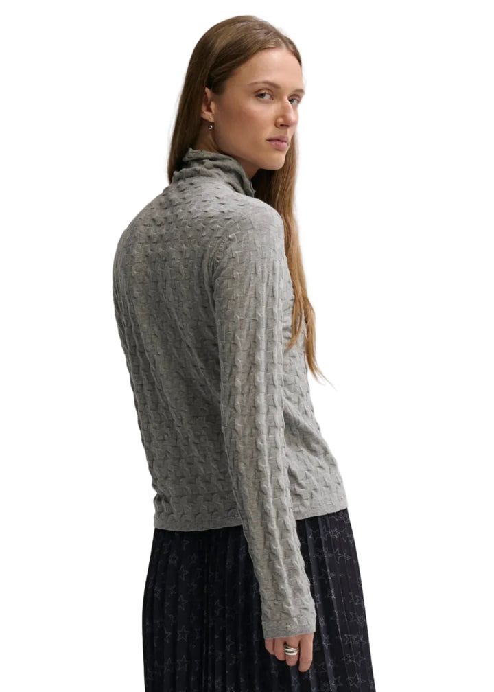back/side view of model wearing the Cloud colored 3D TNECK by Margaret O&