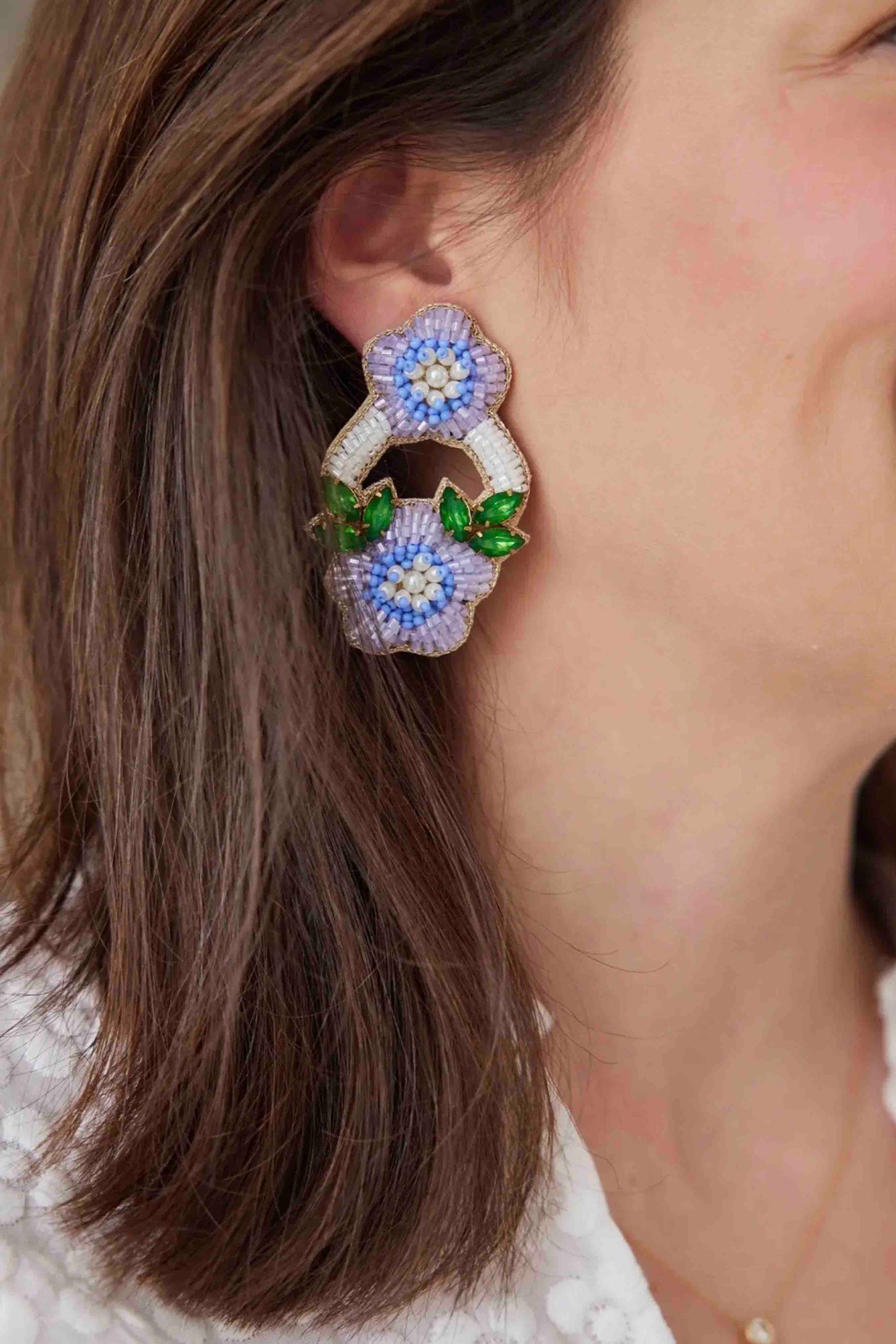 model wearing the Periwinkle East Hampton Flower Earrings by Beth Ladd Collections