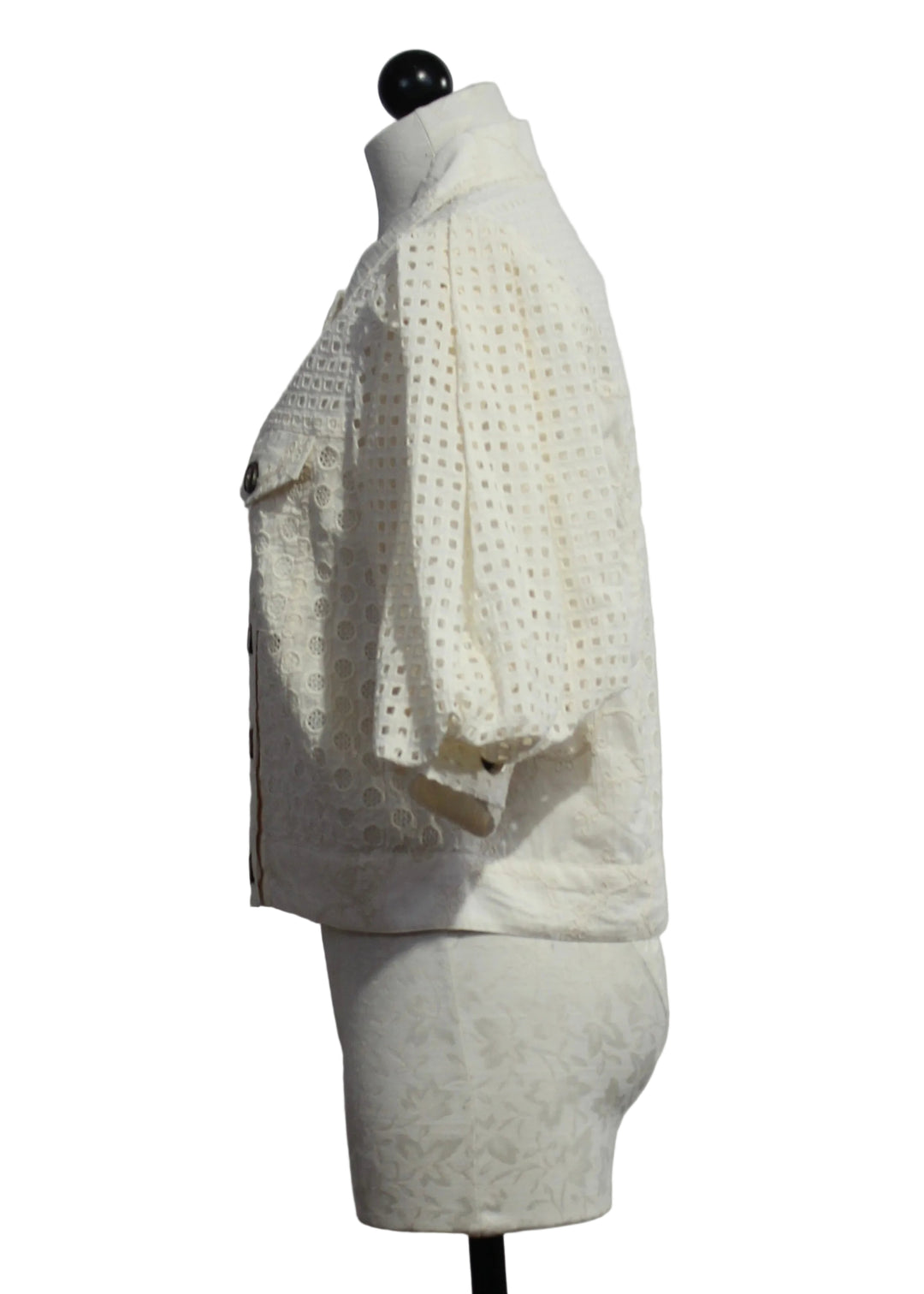 side view of The Eyelet Judy Jacket in Ivory by Emily Lovelock 