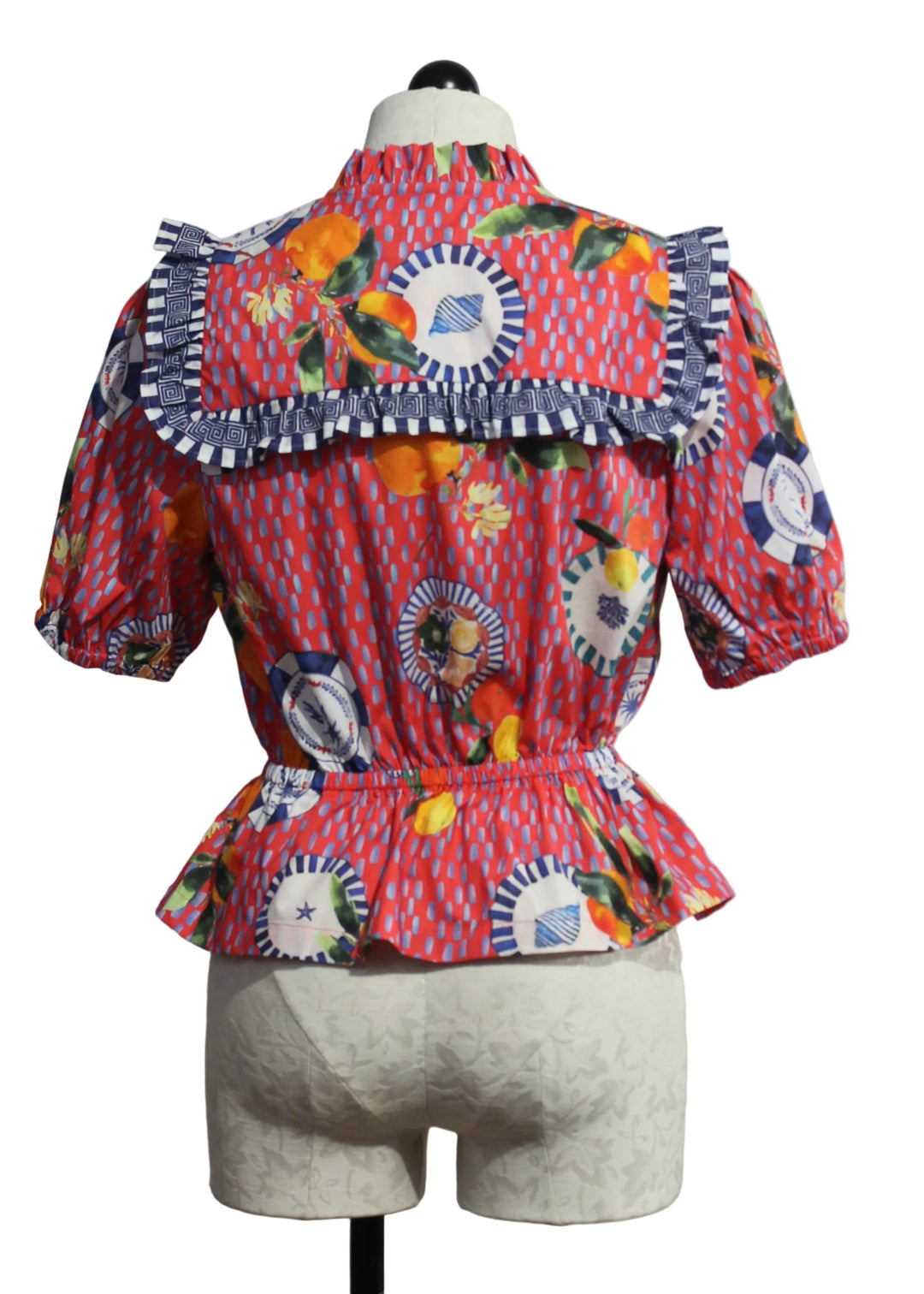 back view of The Freya Blouse by Emily Lovelock in the Lava Red Print