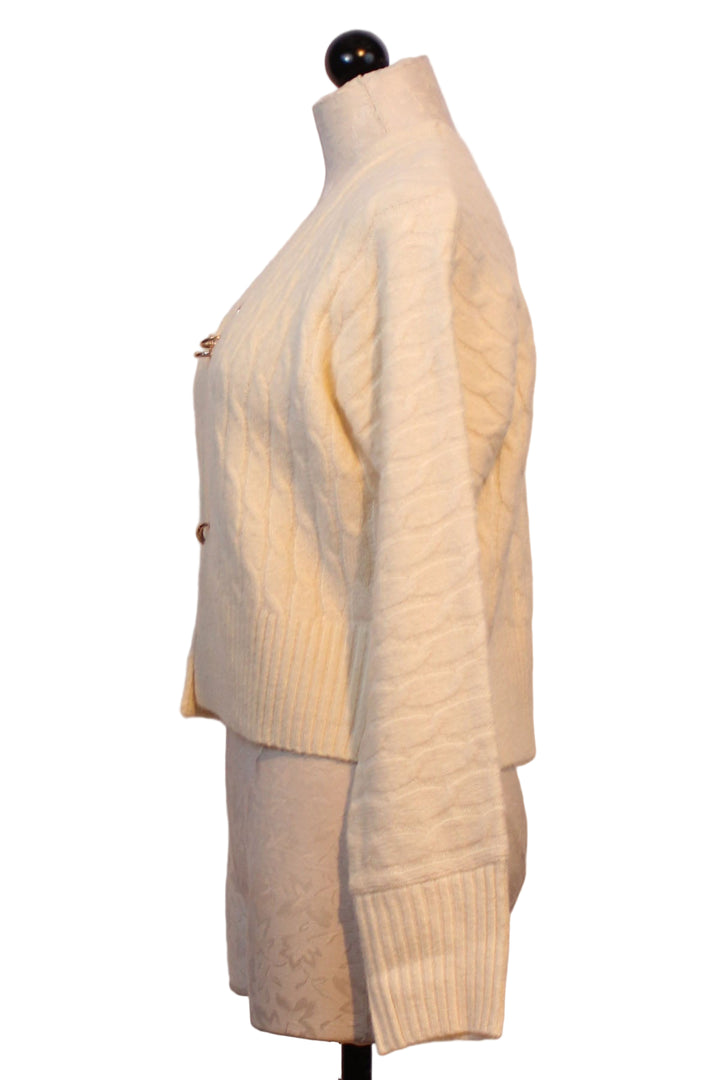 side view of Alabaster colored Emile Cardigan by John and Jenn with chain closures