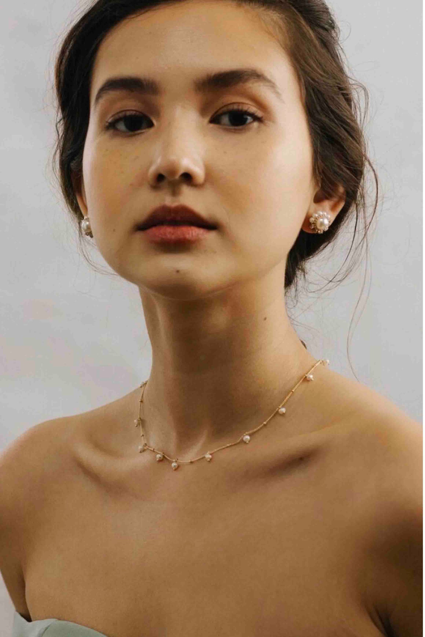 model wearing Empress Pearl Post Earrings by Lover's Tempo