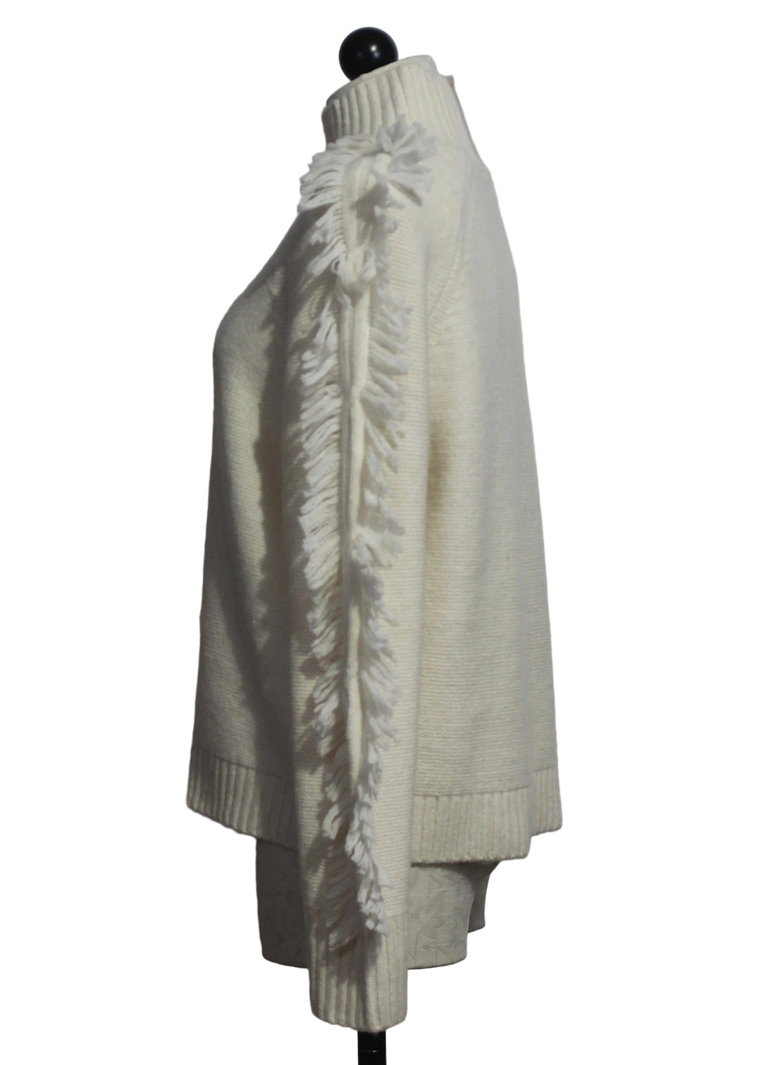 side view of The Winter White Fringe Benefits Sweater by Lisa Todd 