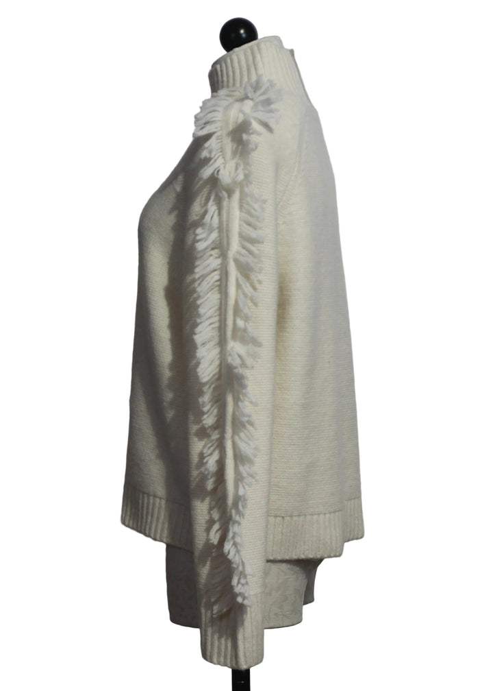 side view of The Winter White Fringe Benefits Sweater by Lisa Todd 