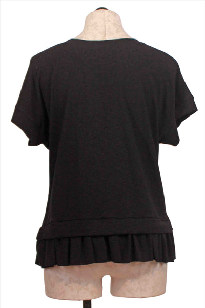 back view of Black Short Sleeve Ruffle Bottom Top by Nally and Millie