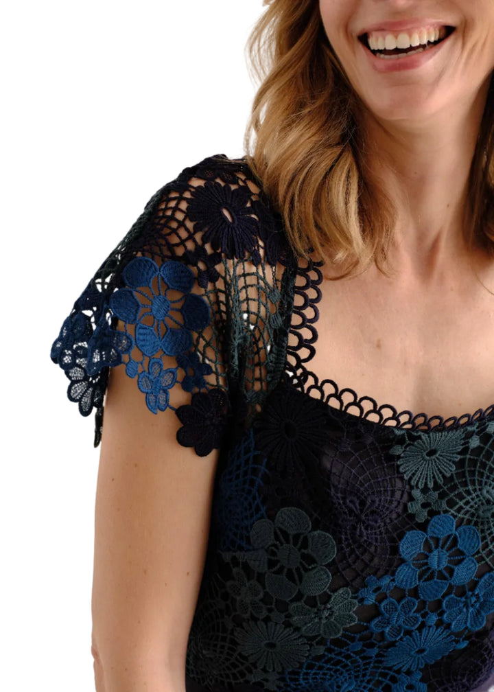 close up detail of the model wearing the Waverly Dress by Cartolina in Lakeside Ombre Lace