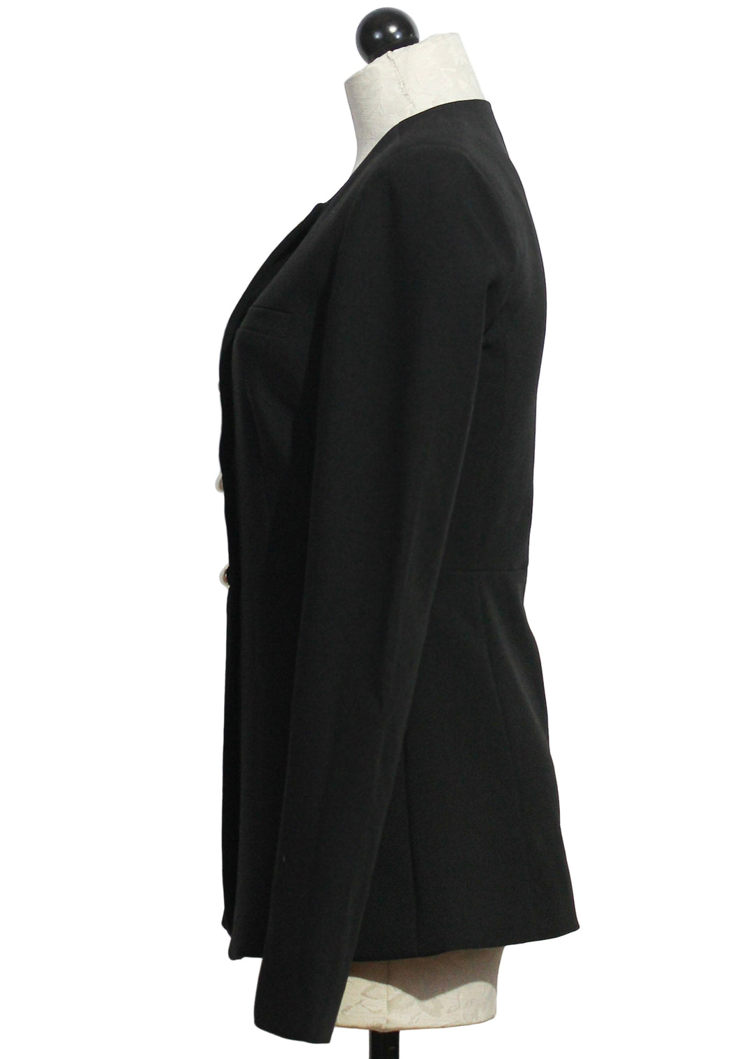 side view of Black Long Sleeve Clocking In Top by Favorite Daughter that is a long-line blazer with a crew neckline and pearlized gold rim buttons