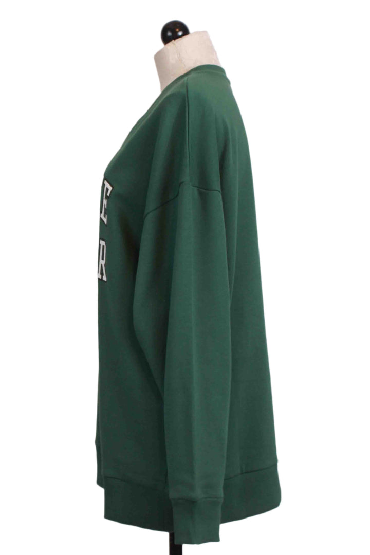 side view of Evergreen Collegiate Sweatshirt by Favorite Daughter