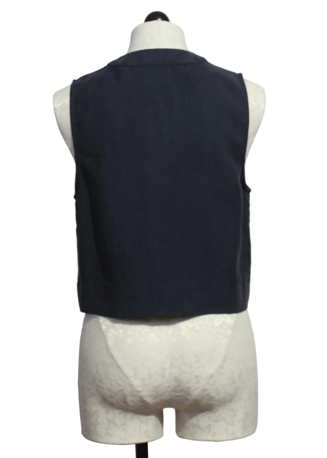 back view of The Sleeveless Navy Fine Line Top by Favorite Daughter 
