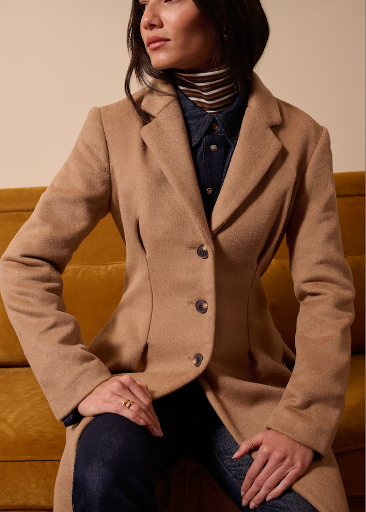 model wearing The Metropolitan Coat by Favorite Daughter in Camel