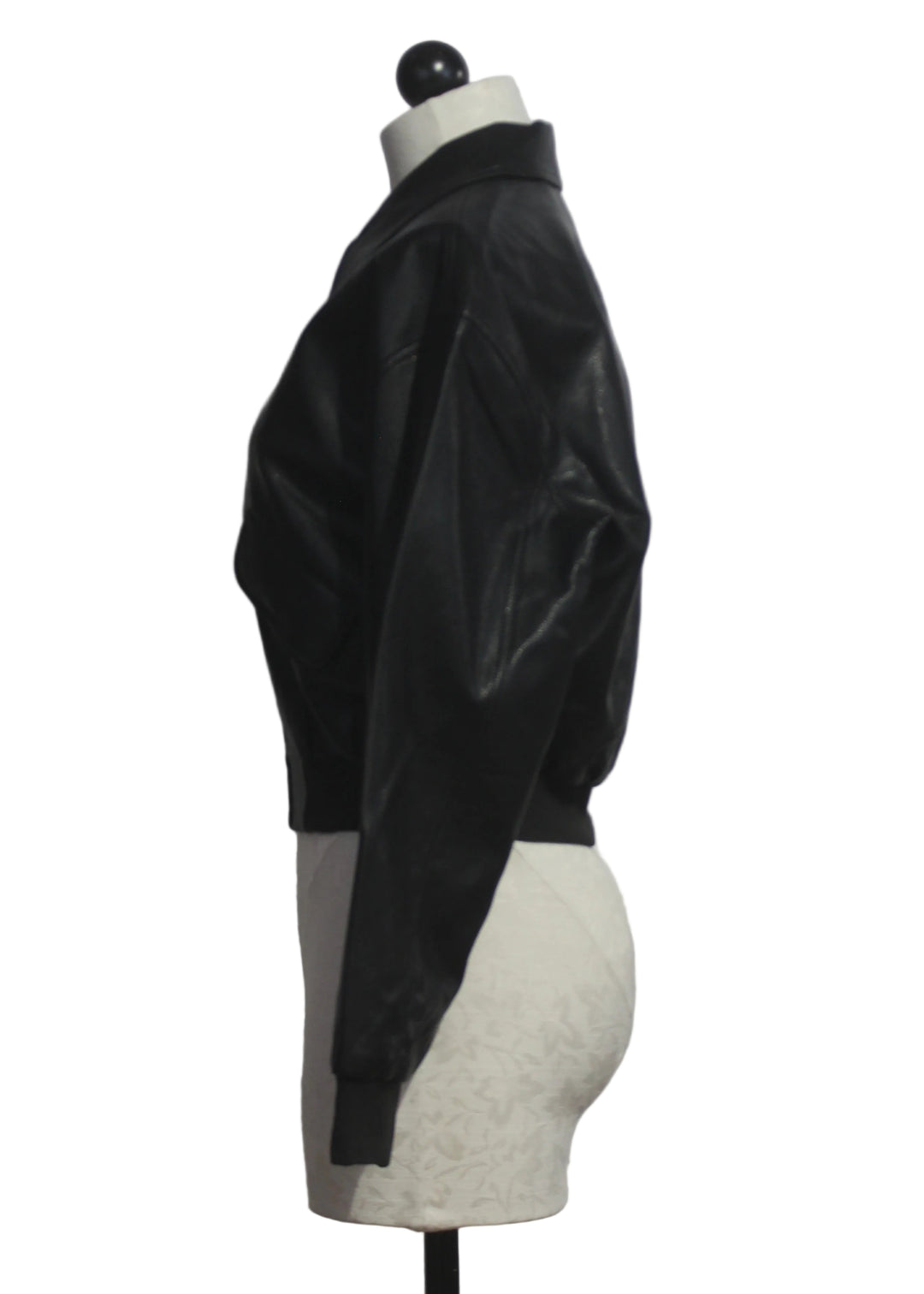 side view of The Better Than Leather Bomber Jacket by Good American in Black001