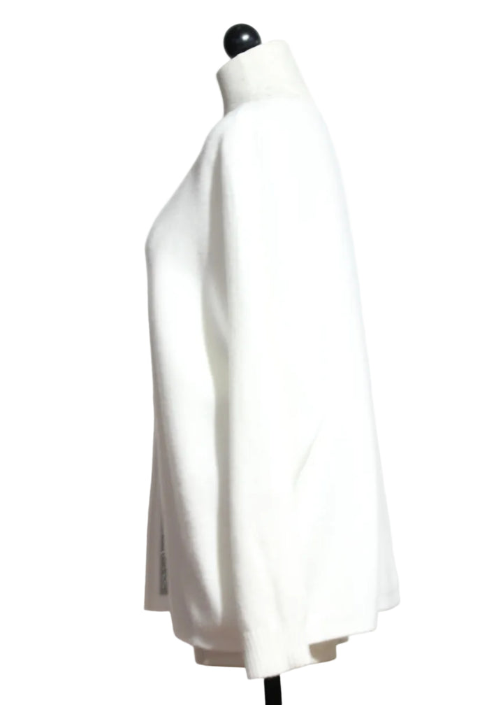 Side view of The Cream Pullover with Crystal Rhinestone Trim by Nikky 