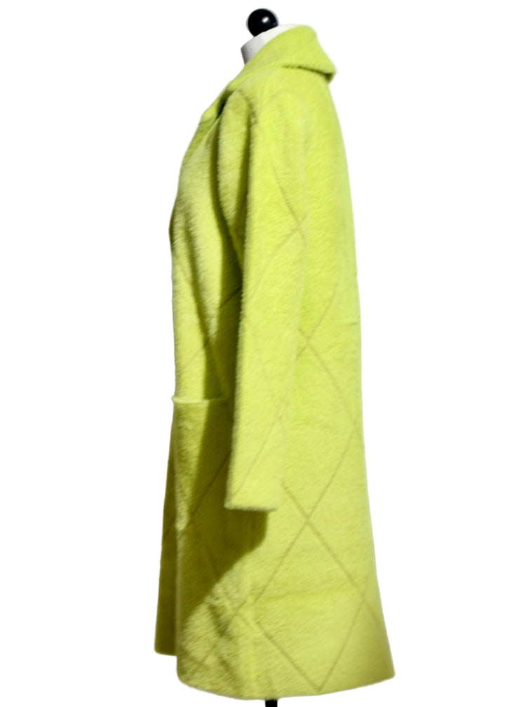 Side view of The Fuzzy Lime Green Coat with Front Pockets by Nikky