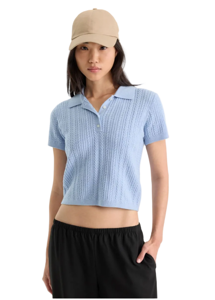Model wearing The Micro Cable Polo by Good American in Sky