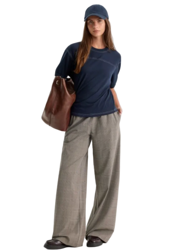 Model wearing The Pull-On Trouser by Good American in the Mini Plaid