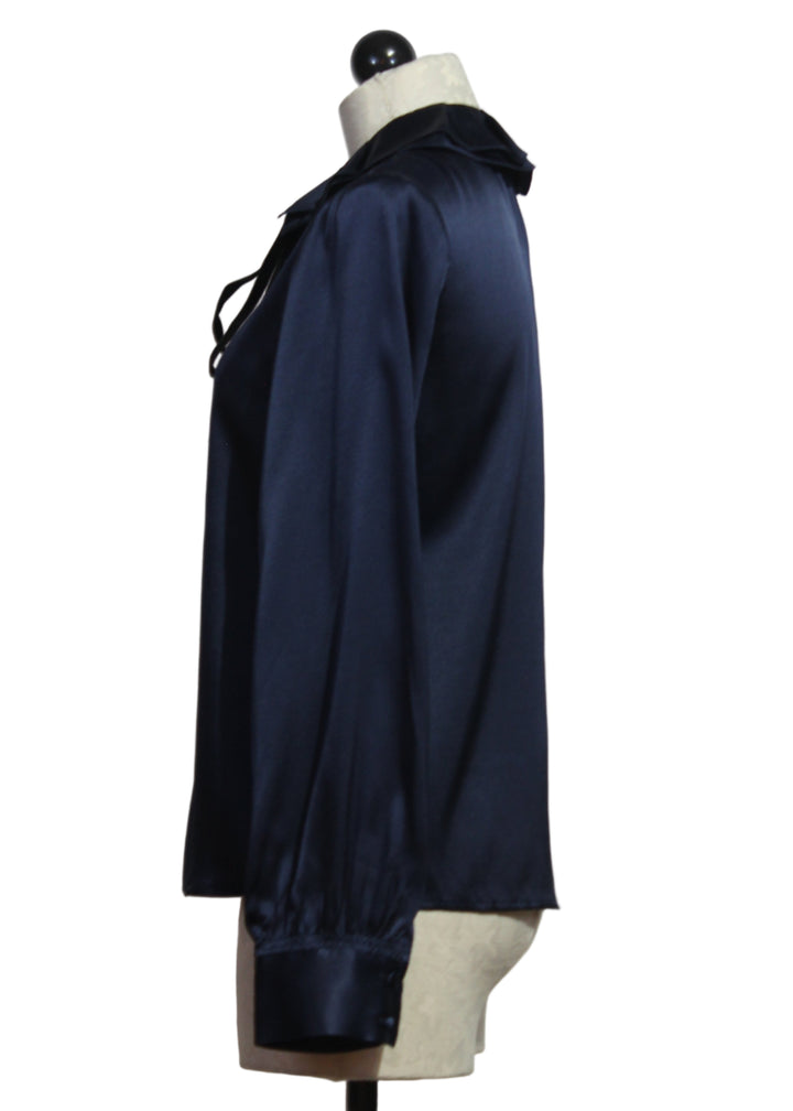 side view of Midnight Blue Emerson Blouse by Cartolina with a Ruffle Collar and a Black Velvet Tie at the neck