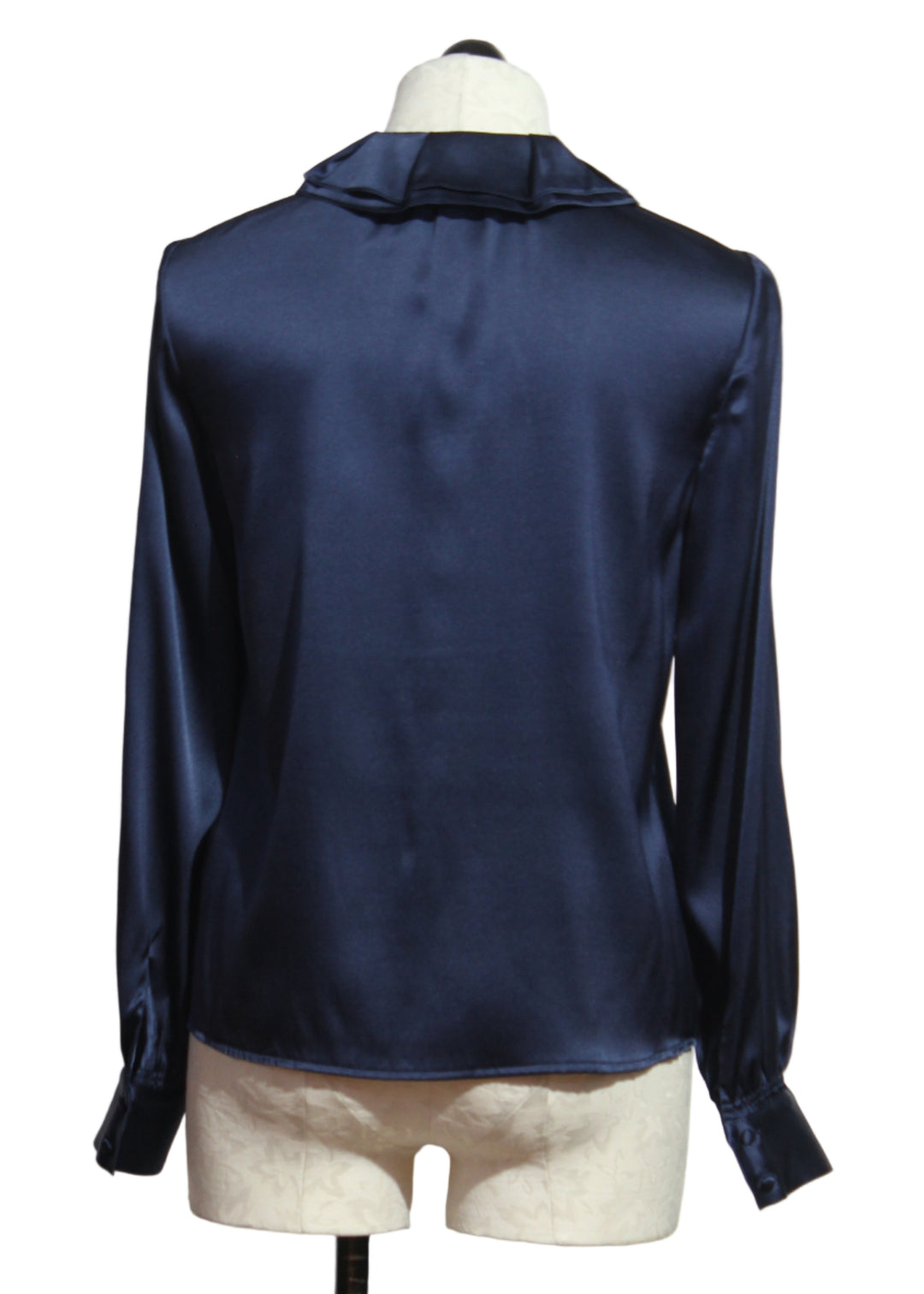 back view of Midnight Blue Emerson Blouse by Cartolina with a Ruffle Collar and a Black Velvet Tie at the neck