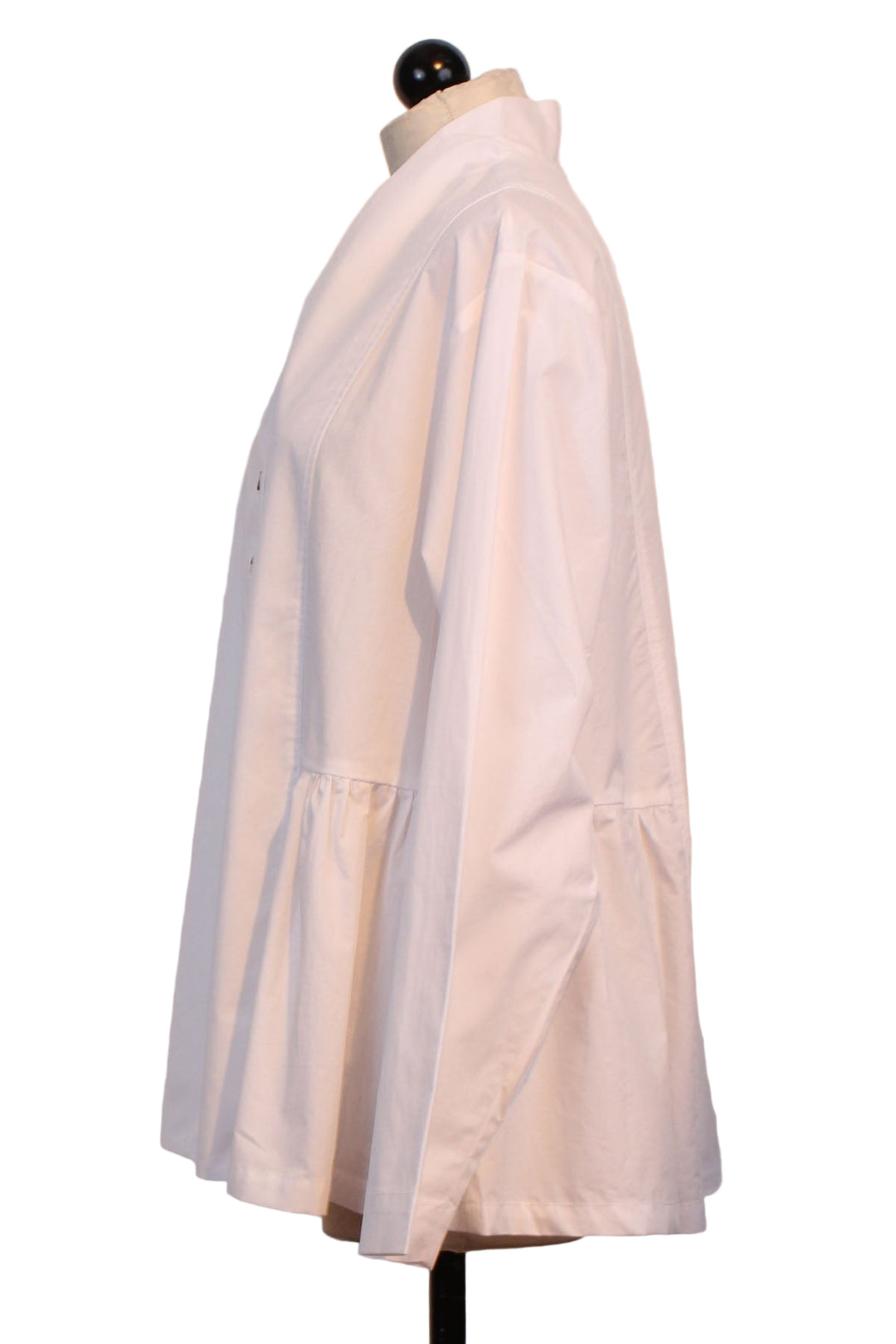 side view of White Peplum Blouse by Alembika