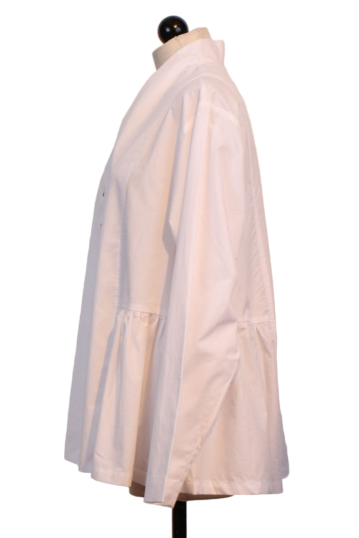 side view of White Peplum Blouse by Alembika