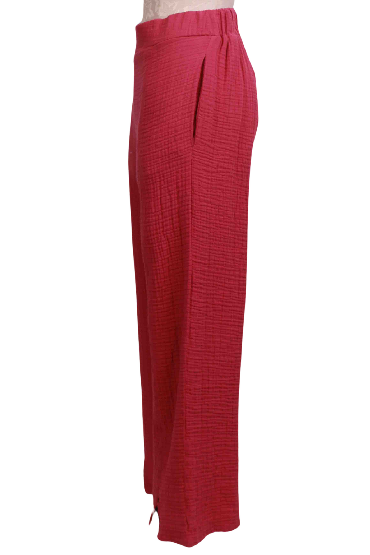 side view of Raspberry Harmony Gauzy Cotton Pant by Kozan with a vent detail at the hemline