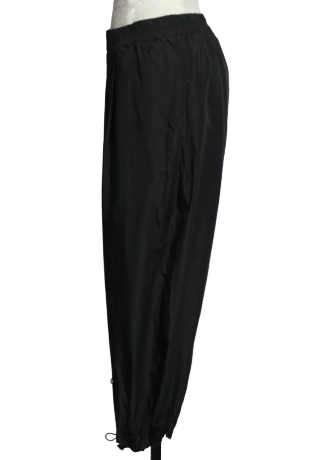 side view of Black The Andi Pant by Kozan is a wide leg cropped pant with drawstring cord hem