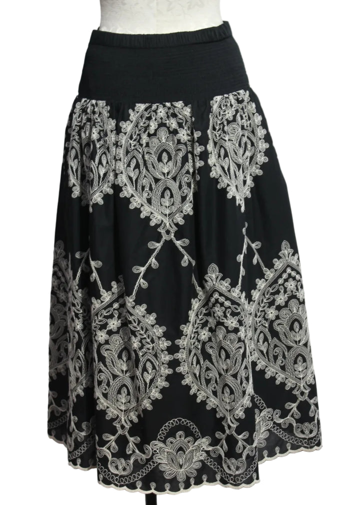 back view of Noir colored Embroidered Georgina Midi Skirt by Cartolina